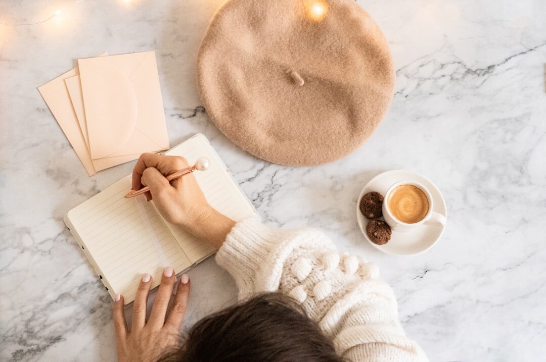 person writing goals in journal