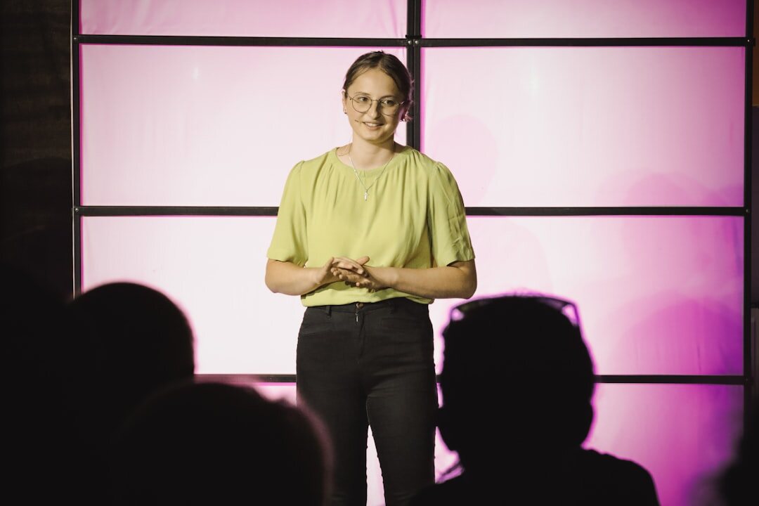 person giving speech on stage