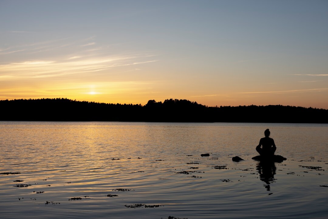 person meditating in nature