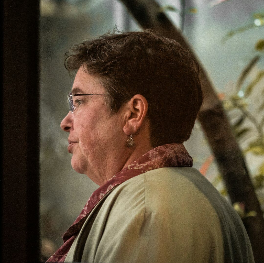 Brazilian woman speaking and gesturing during a personal development workshop
